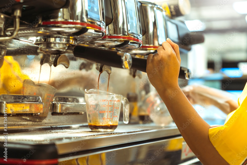 close up of barista working makeing coffee with coffee machine image color tone abstract blur backgr