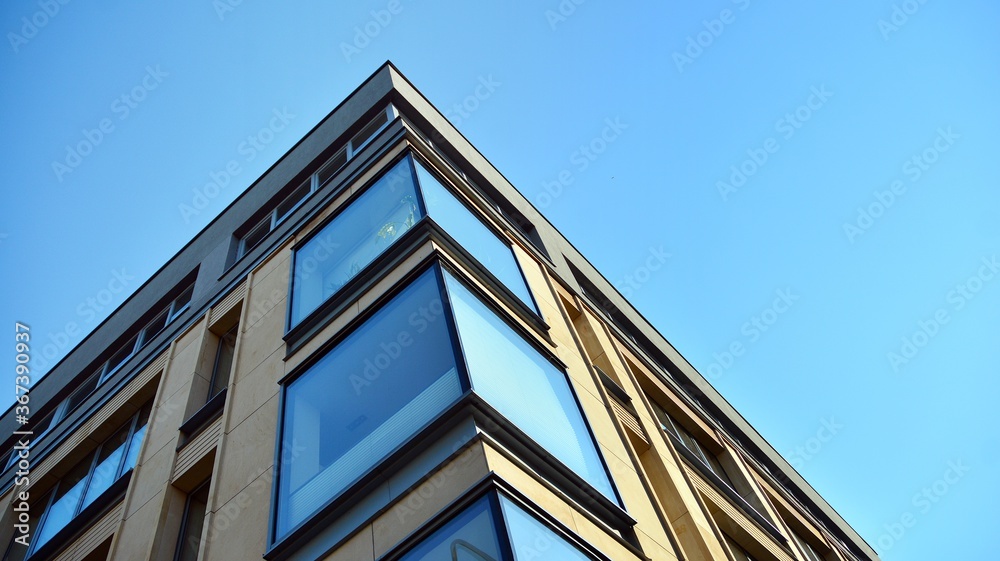 Facade texture of a glass mirrored office building. Fragment of the facade. Modern architecture of t