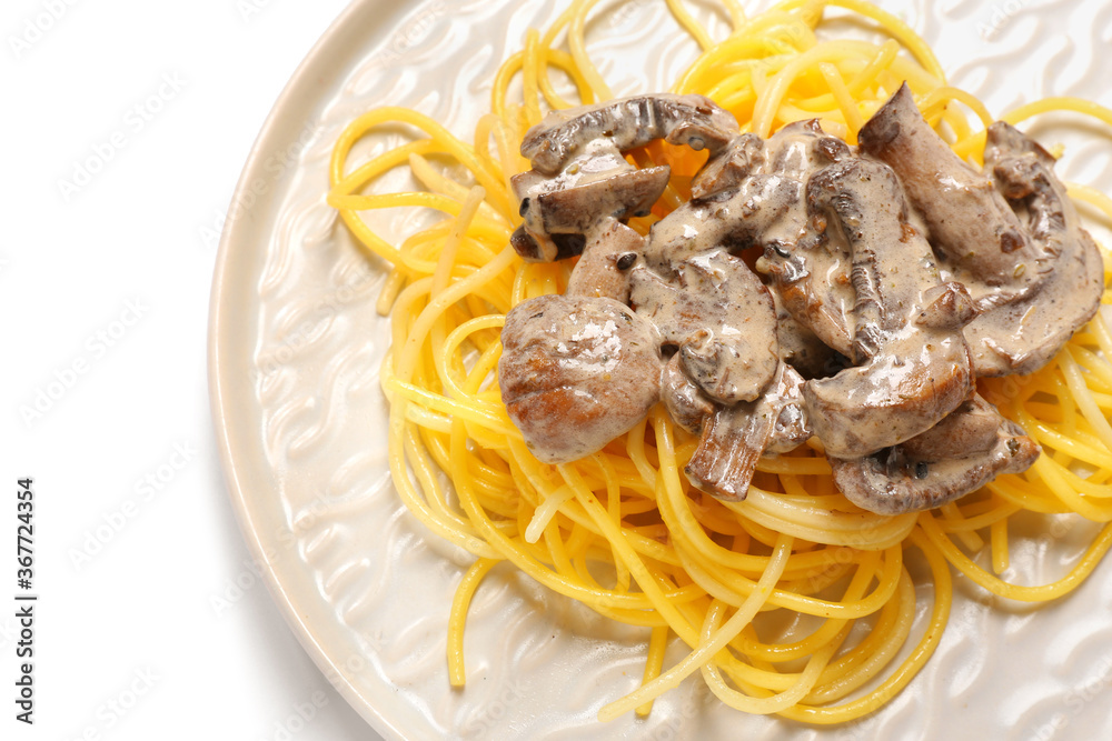 Plate with tasty pasta and mushrooms on white background, closeup