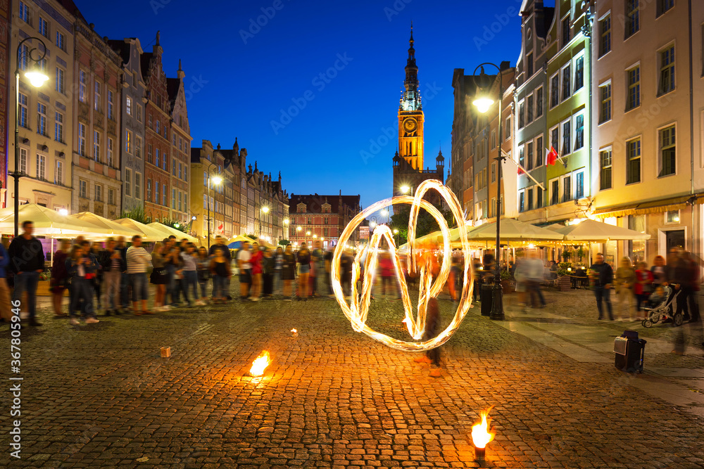 Fire dance at the Long Market in Gdańsk at dusk, Poland