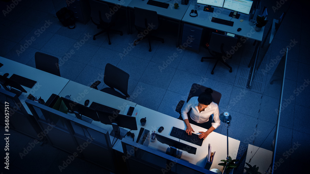 Alone Working Late at Night in the Office: Businesswoman Using Desktop Computer, Analyzing, Using Do