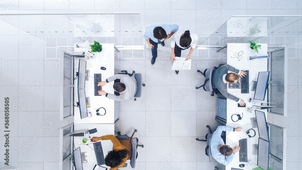 Top Down Shot of Big Busy Corporate Office with Tow Rows off Businessmen and Businesswomen Working o