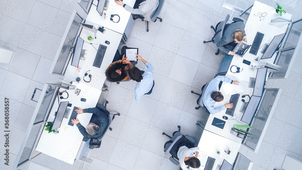 Top Down Shot of Big Busy Corporate Office with Tow Rows off Businessmen and Businesswomen Working o