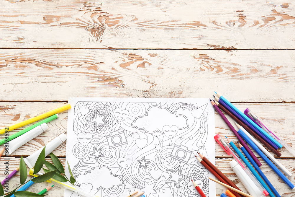 Composition with coloring picture on table