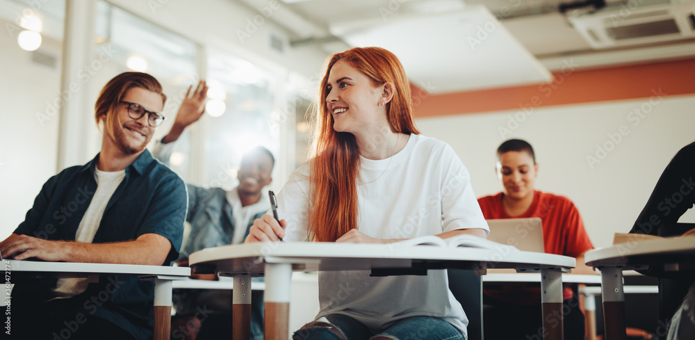 Smiling students in a classroom