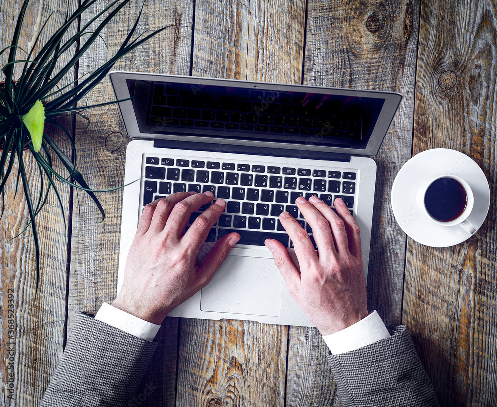 Working place for man with notebook on wooden table