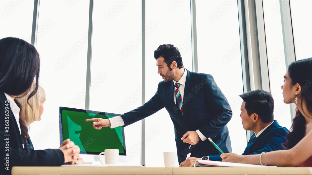 Business people in the conference room with green screen chroma key TV or computer on the office tab