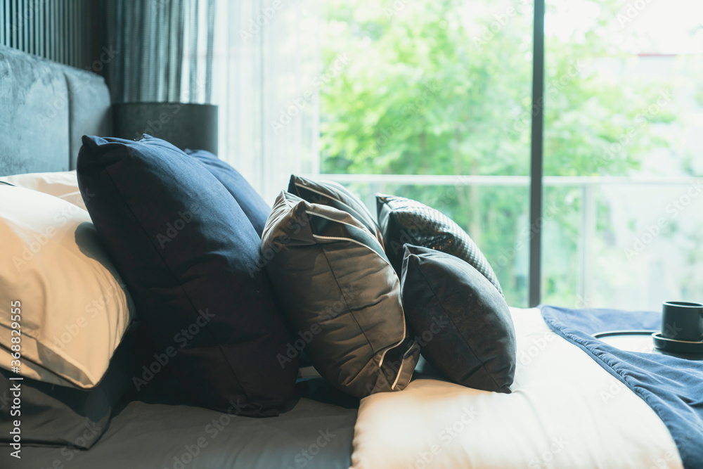 close up white beige soft pillows on bed and blanket bedroom interior design concept.bed maid luxury