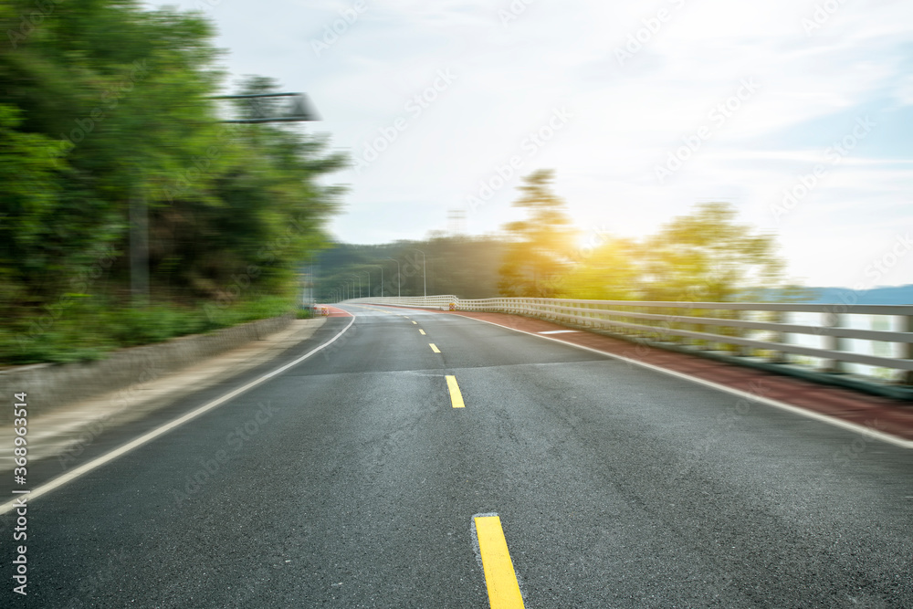 Highway and green mountain background