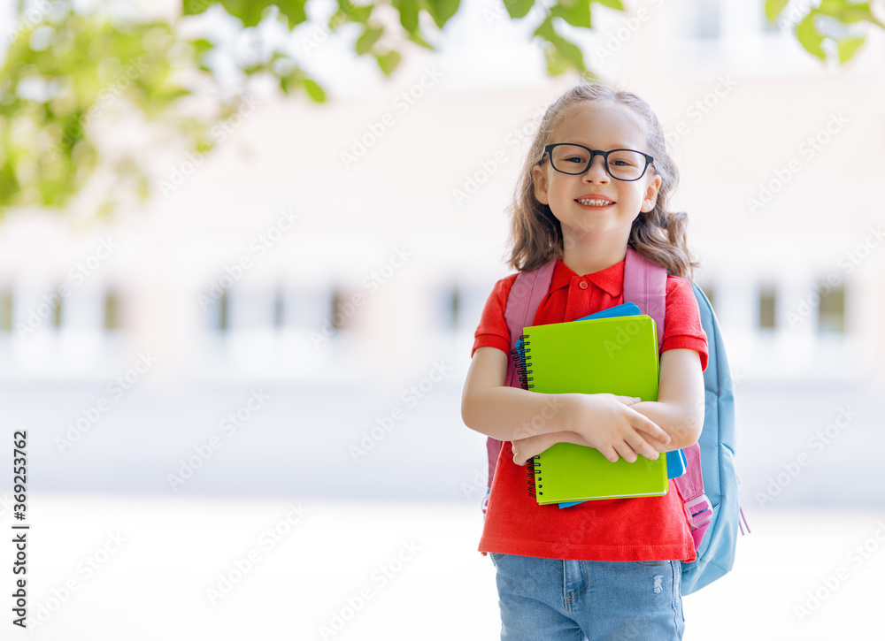 Pupil of primary school with backpack