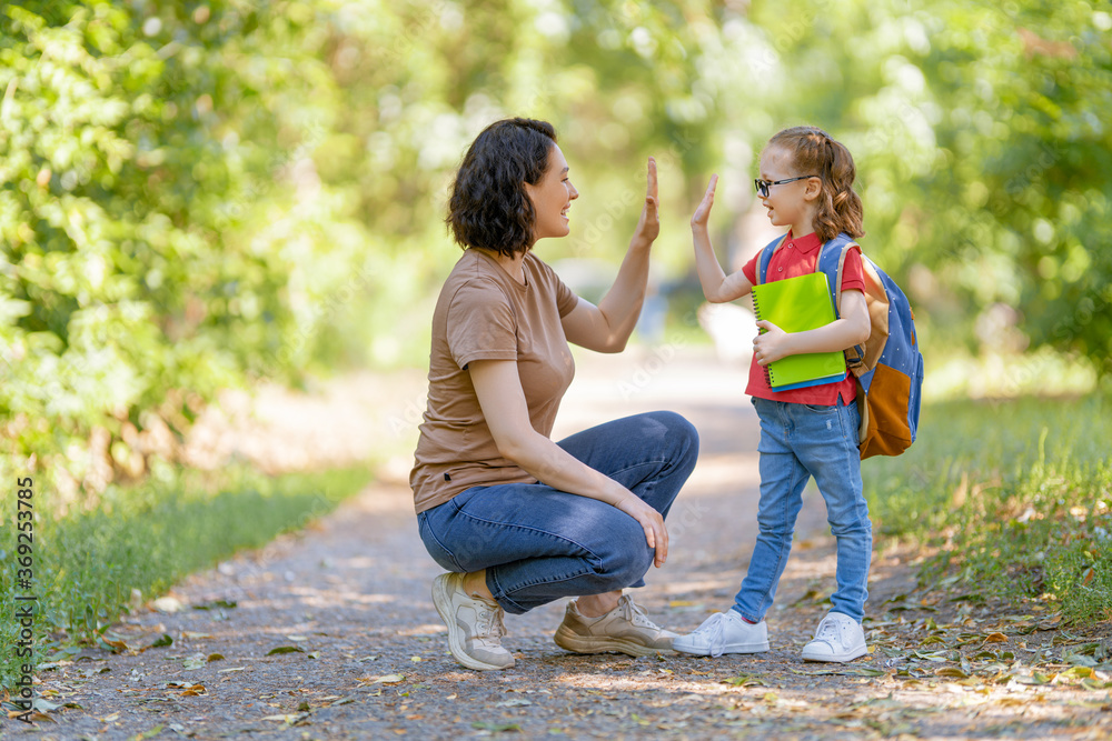 Parent and pupil go to school