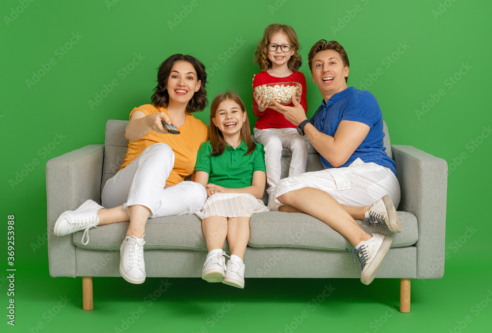 Happy loving family on bright color background.