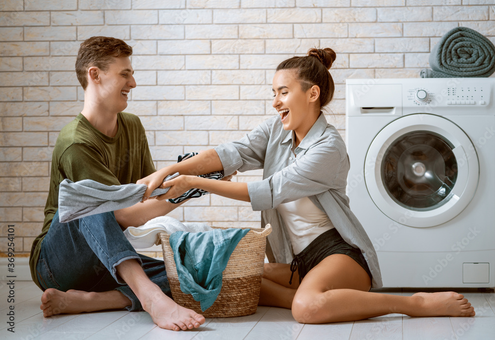 loving couple is doing laundry