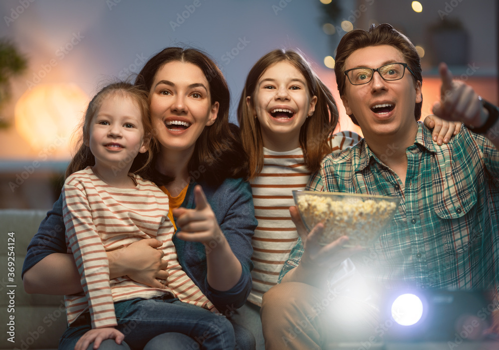 Mother, father and daughters spending time together.