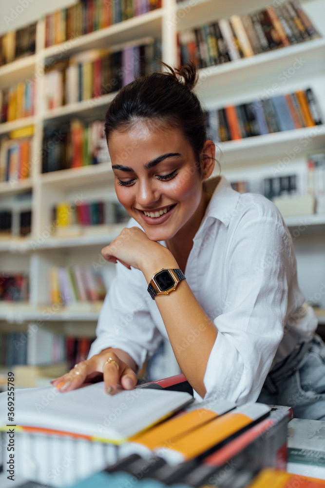 Girl read something funny in the book.