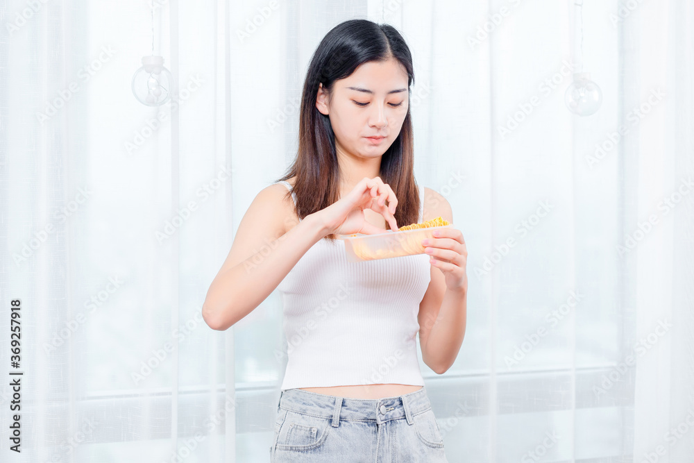 Asian girls eating potato chips

