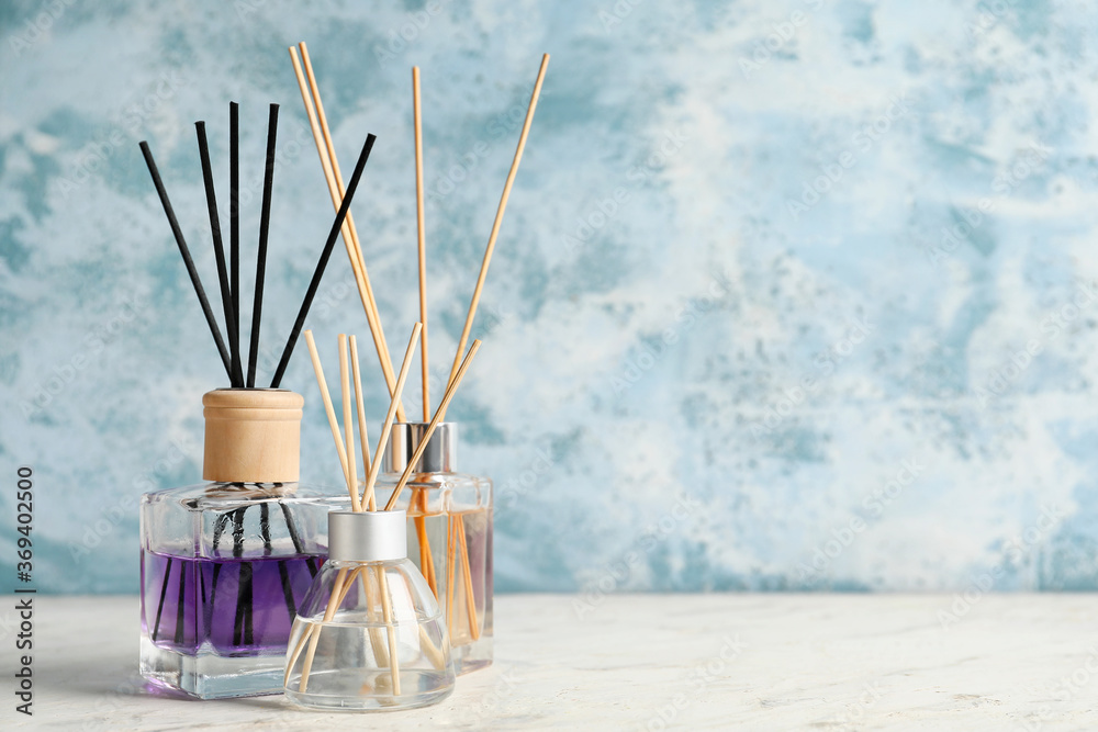 Different reed diffusers on table