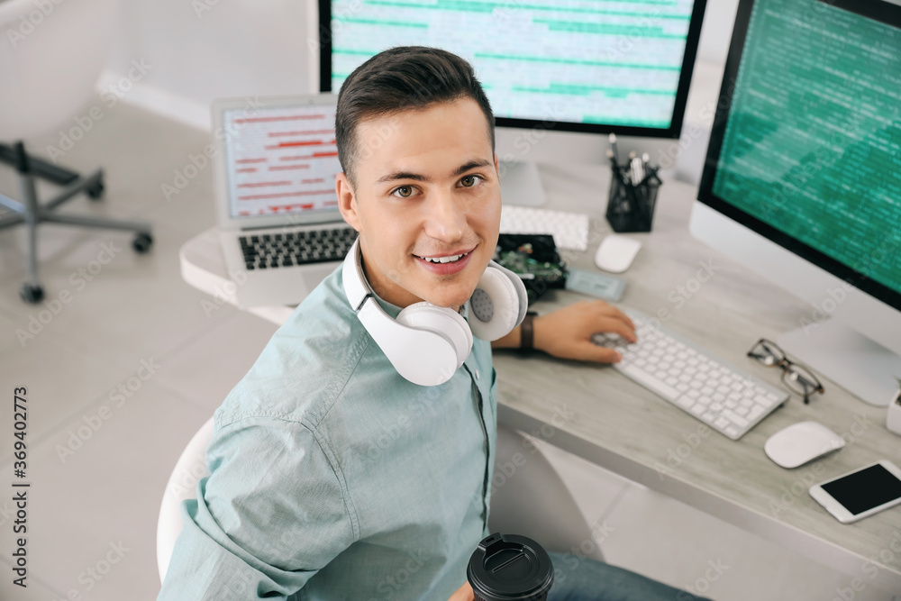 Portrait of male programmer in office