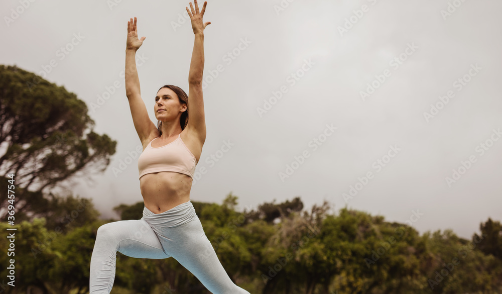 Woman in a yoga pose outdoors