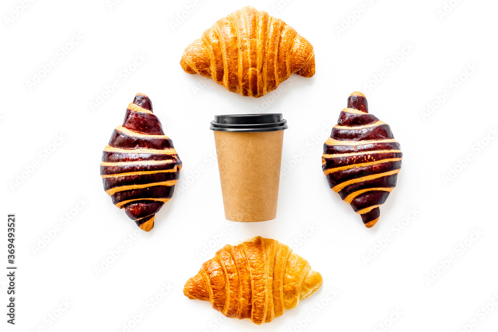 Set of coffee with croissants - chocolate, berry, classic - on white top view