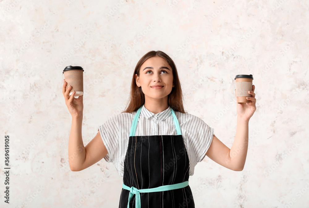 Female barista on light background