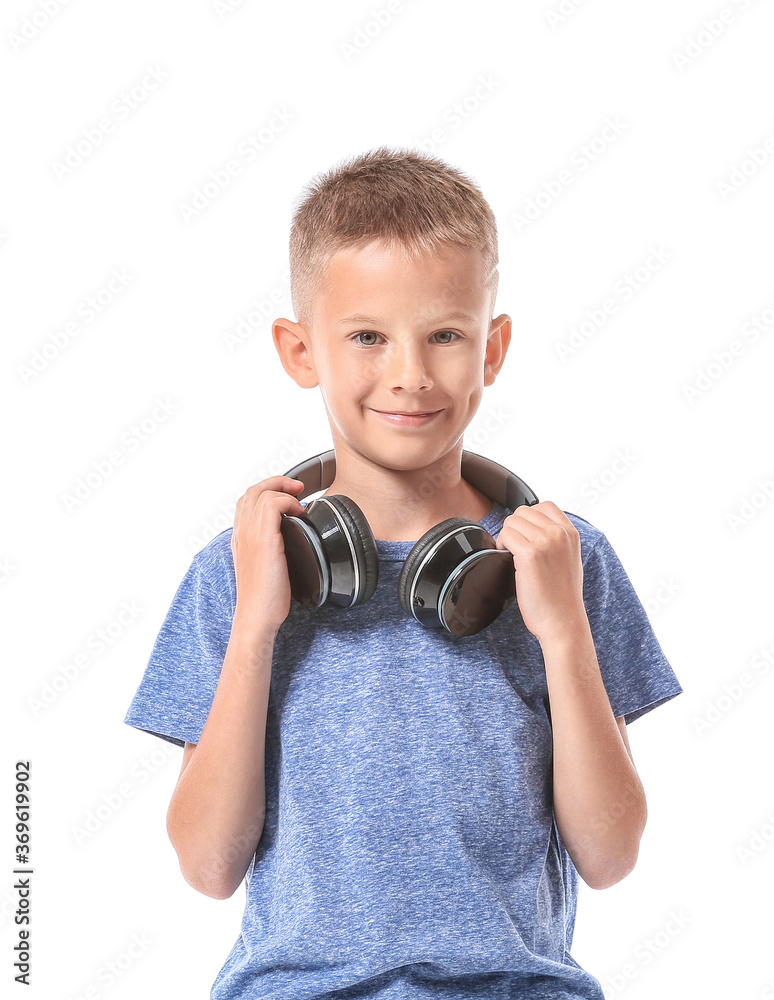 Cute little boy with headphones on white background