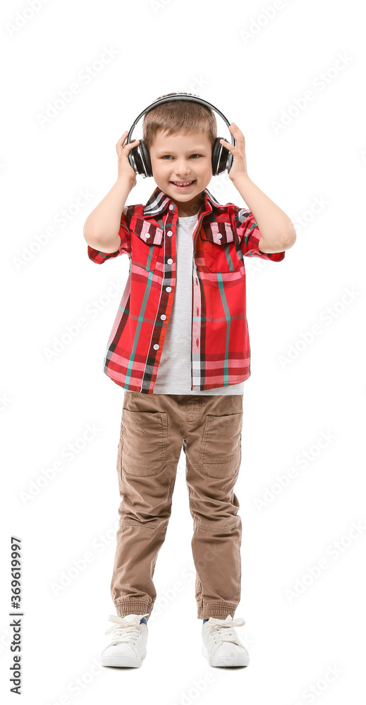 Cute little boy with headphones on white background