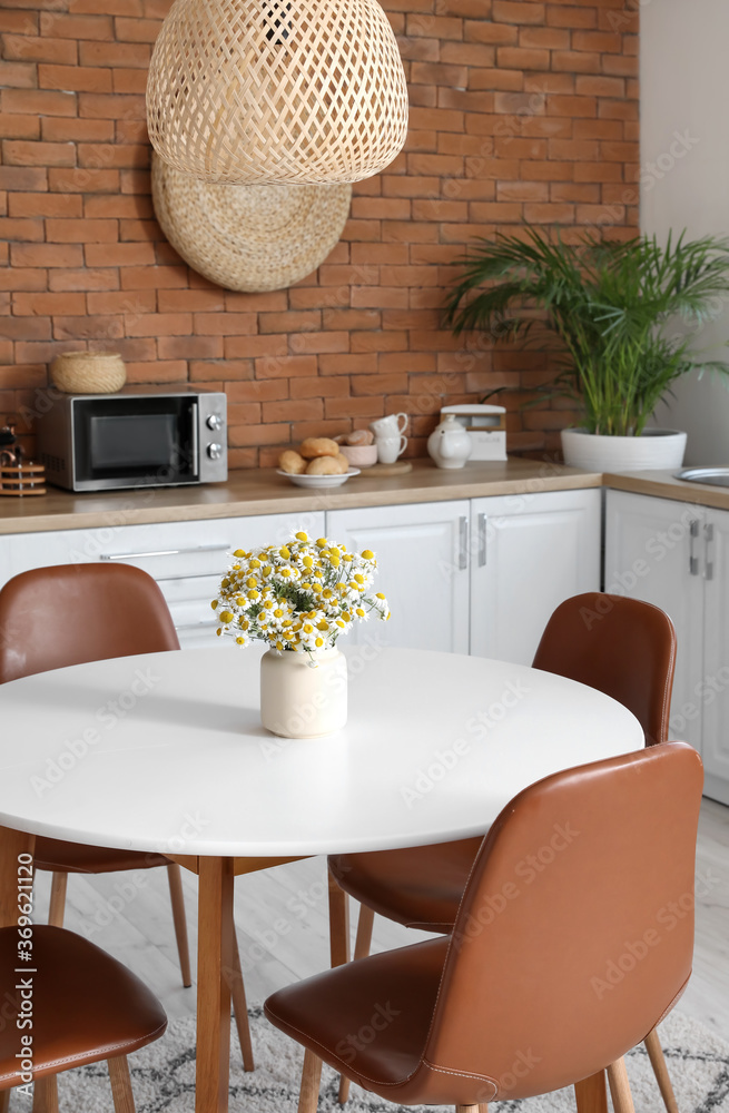 Dining table in interior of modern kitchen