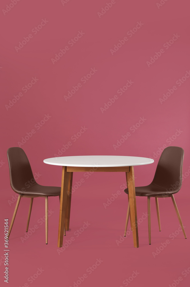 Dining table with chairs on color background