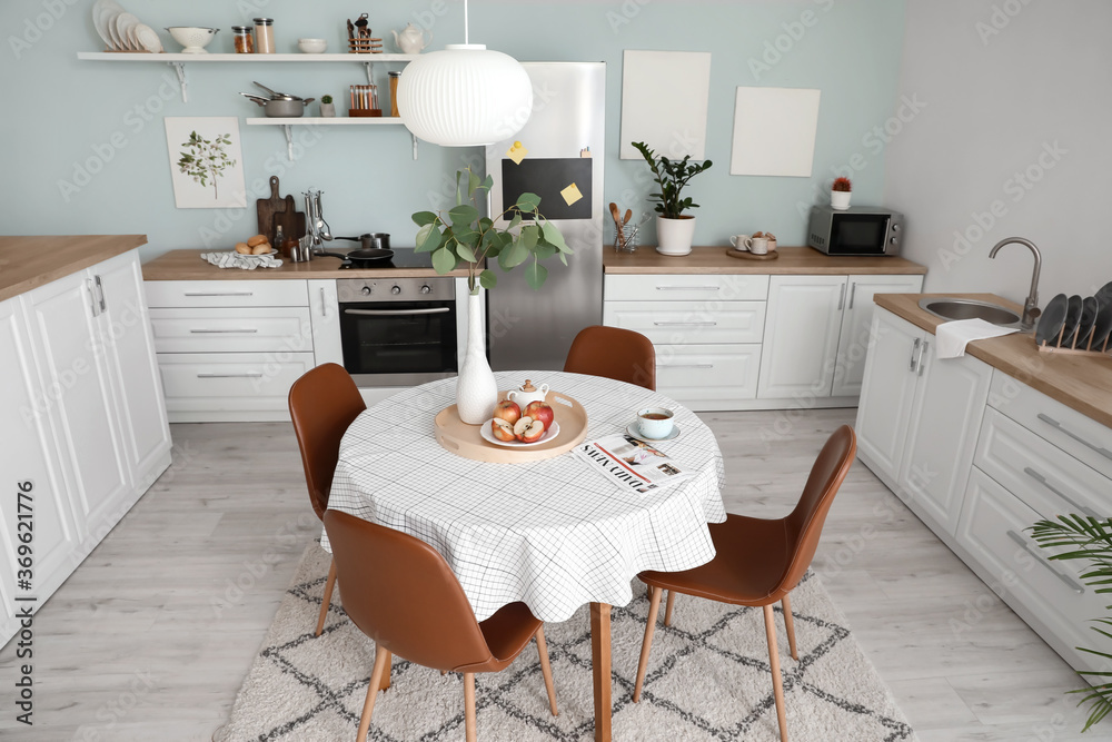 Interior of stylish modern kitchen with dining table