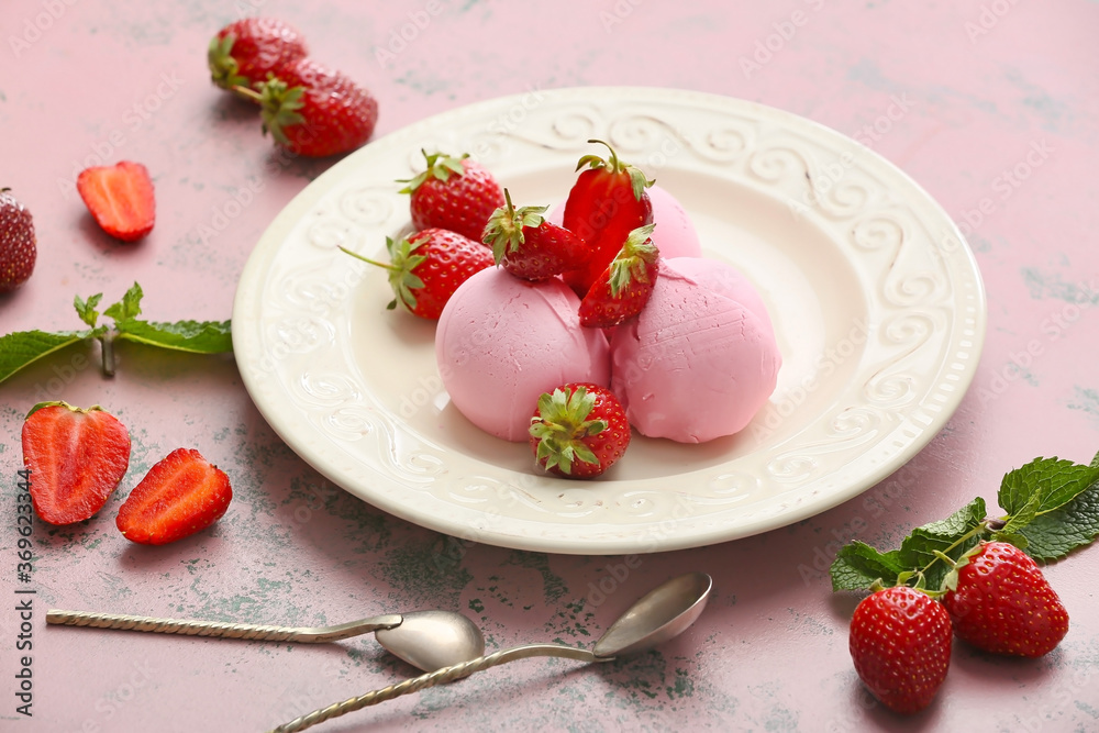 Plate with tasty strawberry ice cream on color background