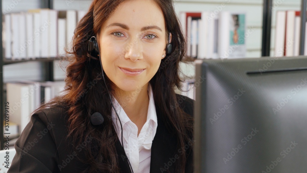 Business people wearing headset working in office to support remote customer or colleague. Call cent