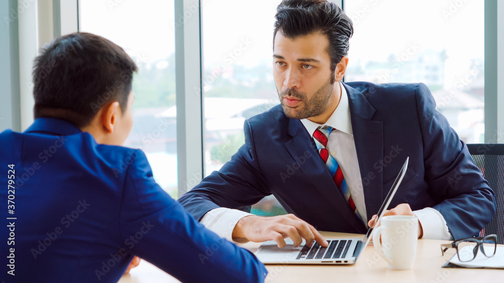 Job seeker in job interview meeting with manager and interviewer at corporate office. The young inte