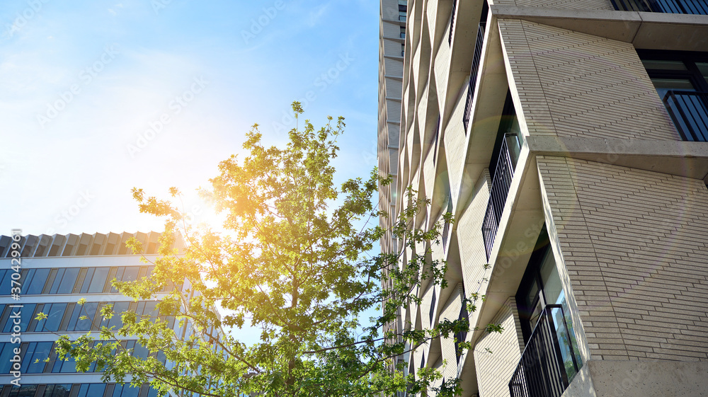 New housing landscape. Facade of a new multi-story residential building.