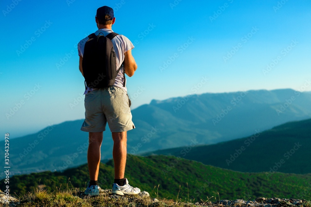 Man Standing on Mountain