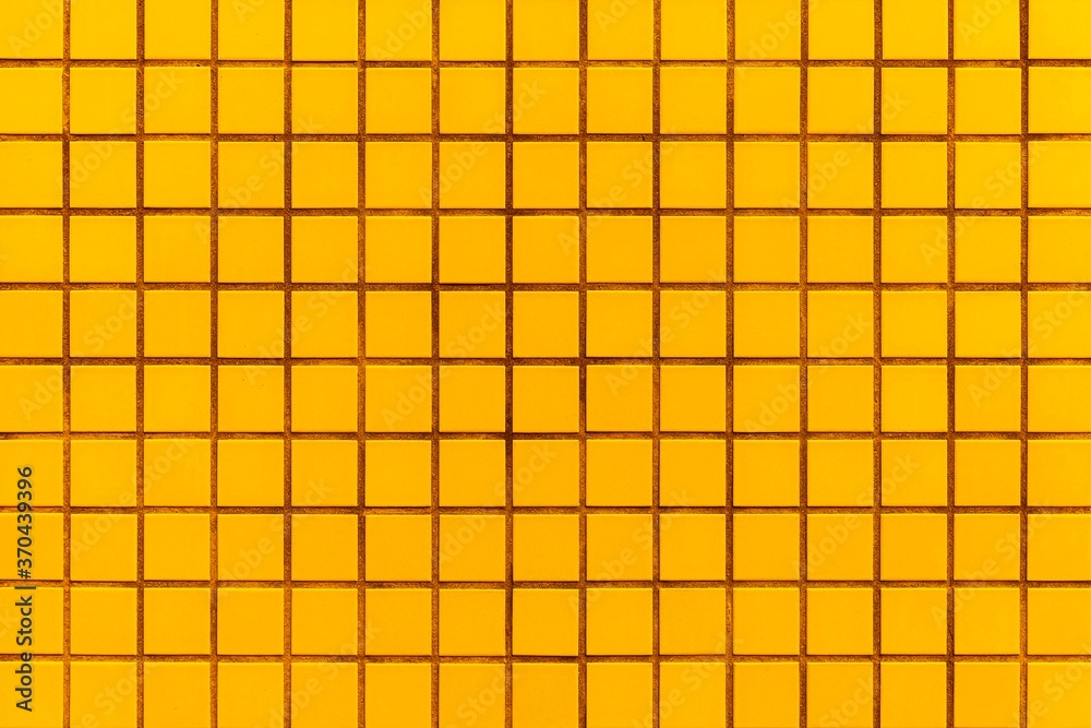 Yellow mosaic wall tile pattern and seamless background