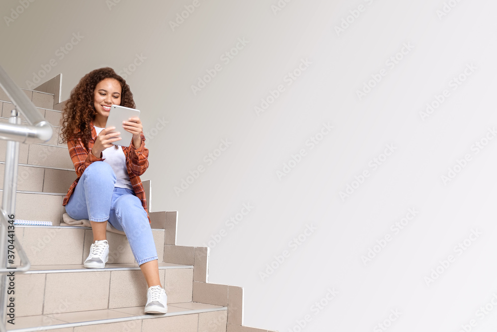 Young woman using tablet computer for online learning