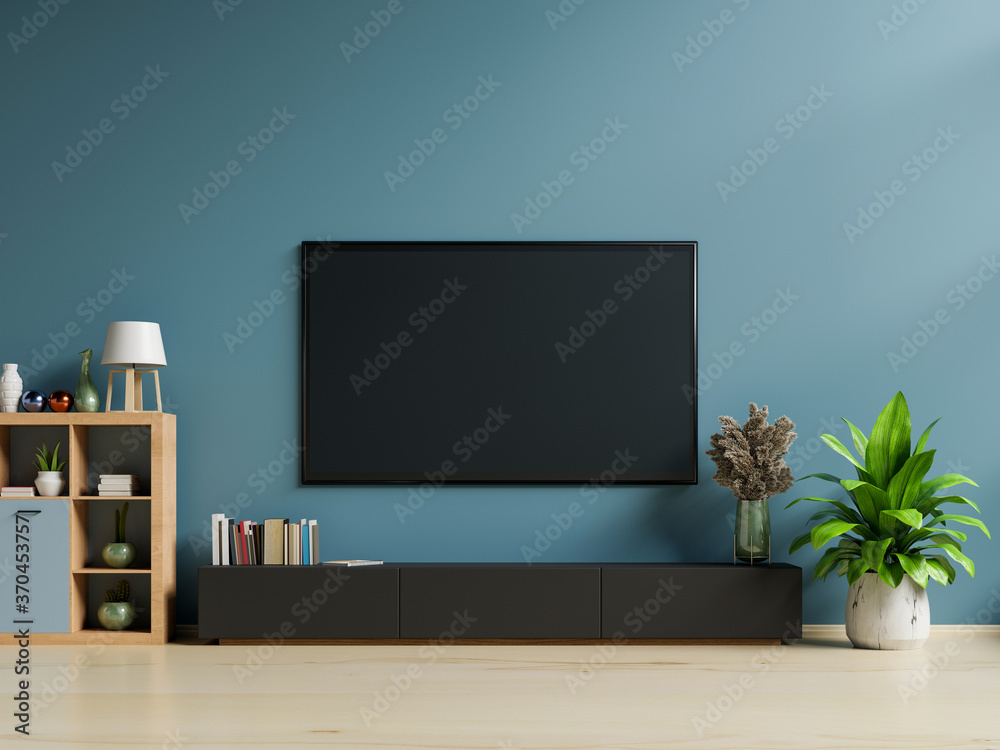 Smart TV on the dark blue wall in living room,minimal design.