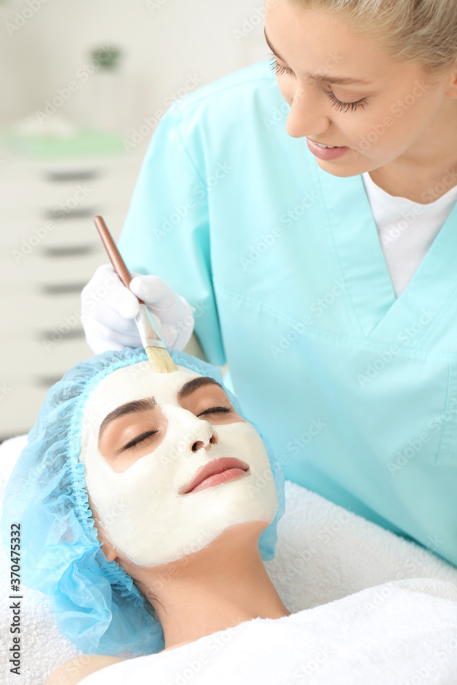 Young woman undergoing treatment in beauty salon