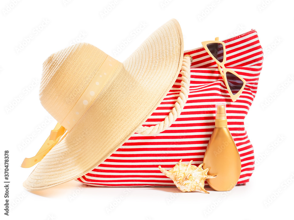 Beach bag with accessories on white background