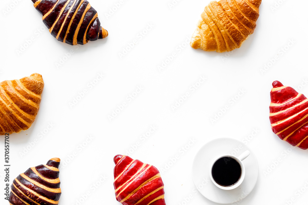 Frame of croissants - fresh bakery on white background. Top view