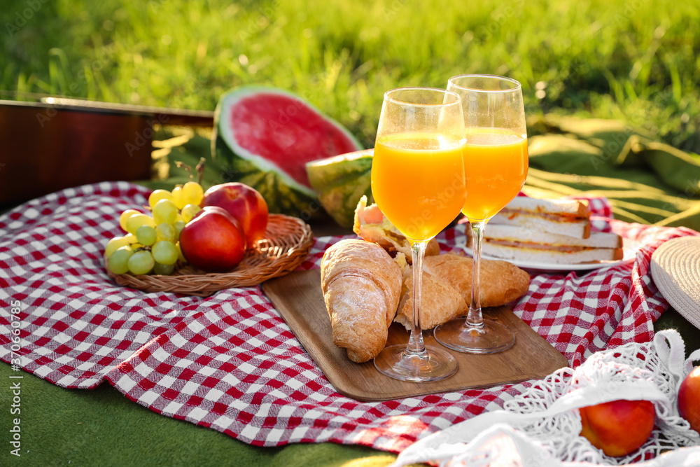 Tasty food and drink for romantic picnic in park