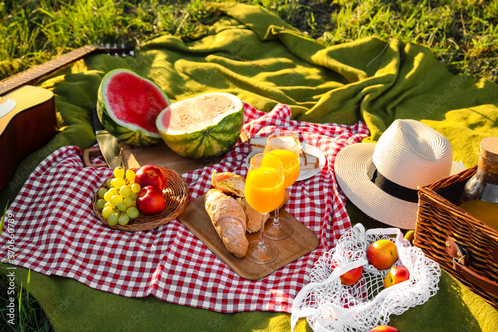 Tasty food and drink for romantic picnic in park