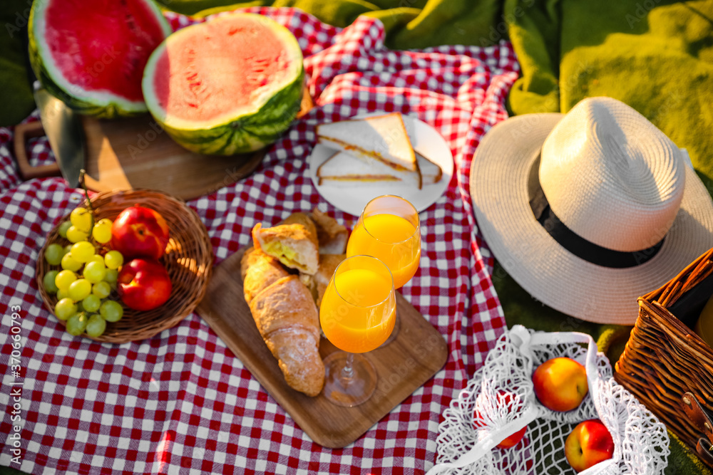 Tasty food and drink for romantic picnic in park