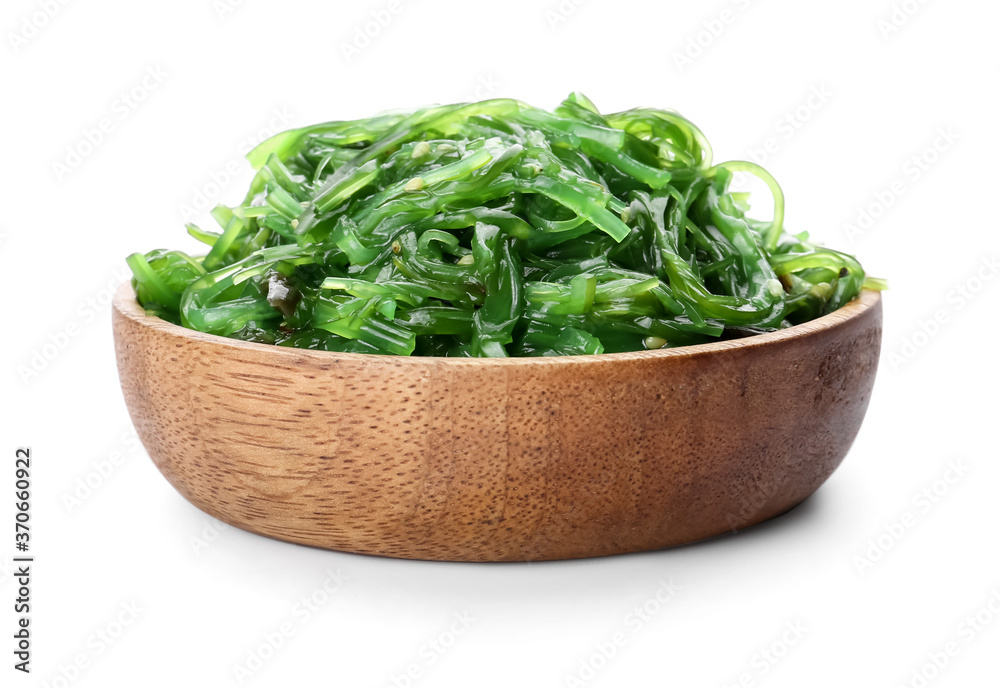 Bowl with tasty seaweed salad on white background