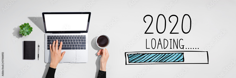 Loading new year 2020 with person using a laptop computer