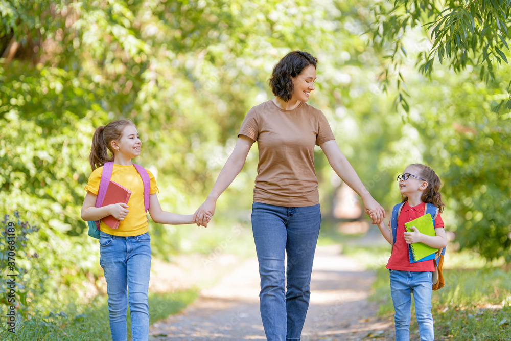 Parent and pupils go to school