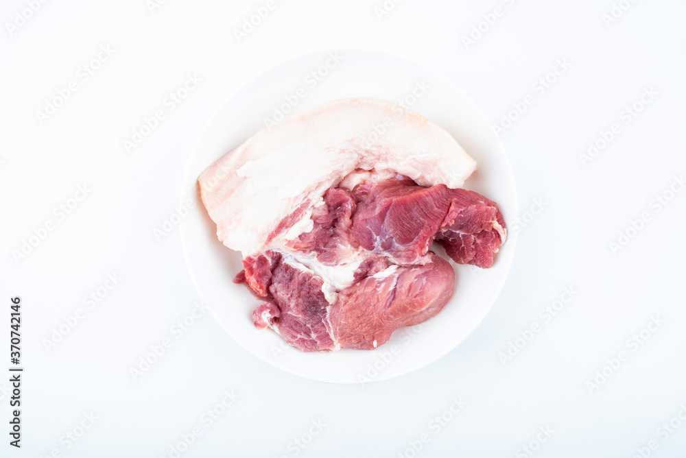 Fresh front leg pork on a plate on white background