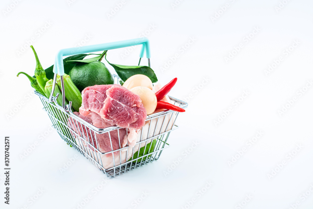 Vegetable basket full of pork, vegetables and fruits