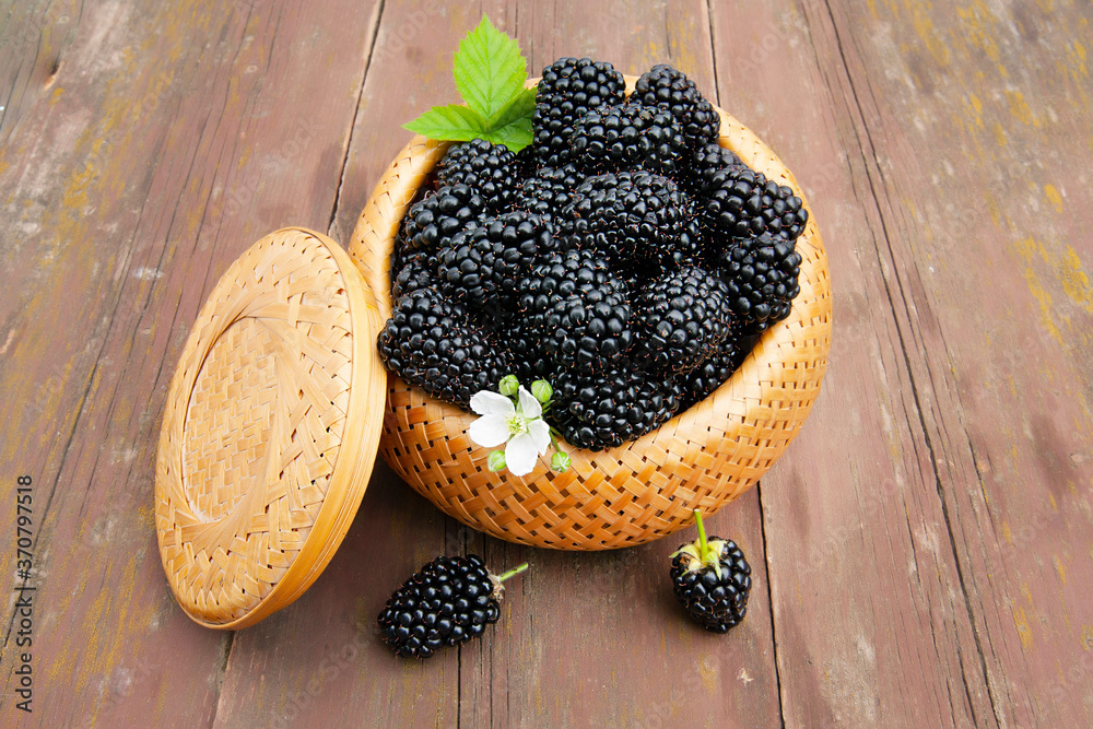 large ripe blackberries in a wicker basket